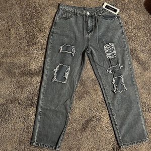 Light color denim jeans with leg holes